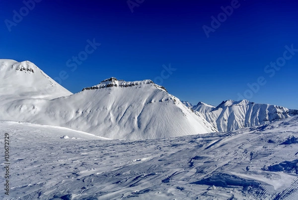 Obraz Winter in Greater Caucasus Mountains. Georgia (country). Gudauri ski resort. View from Mt. Kudebi.