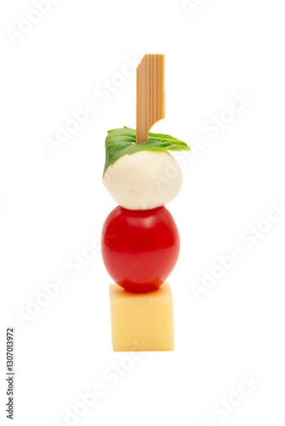 Fototapeta Caprese skewer with tomato and cheese on a white background