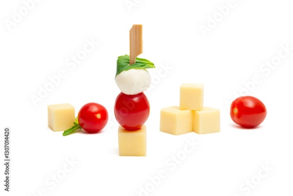 Fototapeta Caprese skewer with cherry tomatoes and cheese cubes on a white background