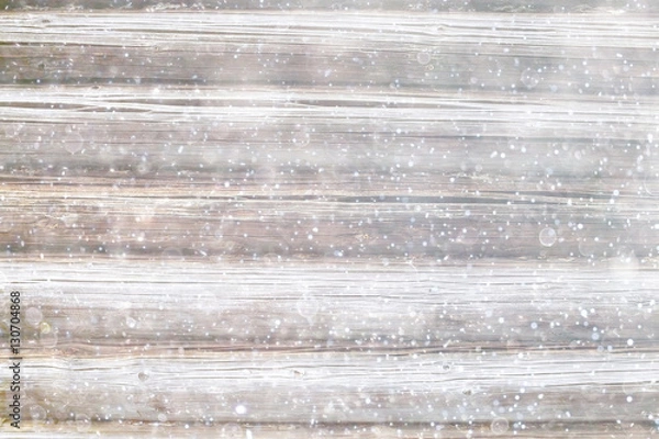 Fototapeta blurred wooden background with snow winter