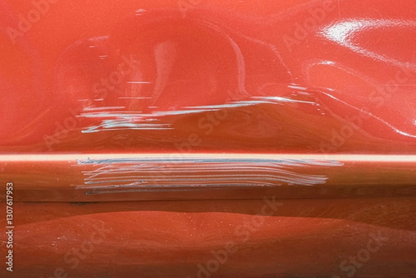 Obraz Close up of a red car with multiple visible scratches and paint damage The scratches expose the underlying metal, creating a contrast against the glossy surface. Perfect for automotive damage concepts