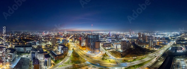 Fototapeta Panoramic Aerial View of Leeds City Center at Dawn with Illuminated Buildings