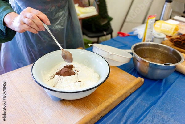 Fototapeta The chef is making a chocolate cake.