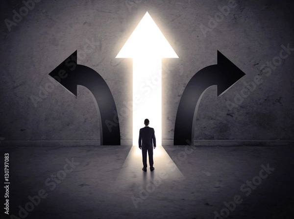 Fototapeta Businessman in front of three arrows