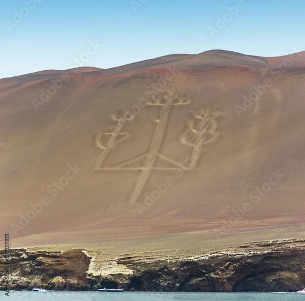 Fototapeta Ancient large-scale geoglyph Candelabrum figure in Paracas national park. It is a designated UNESCO World Heritage Site - Peru, South America