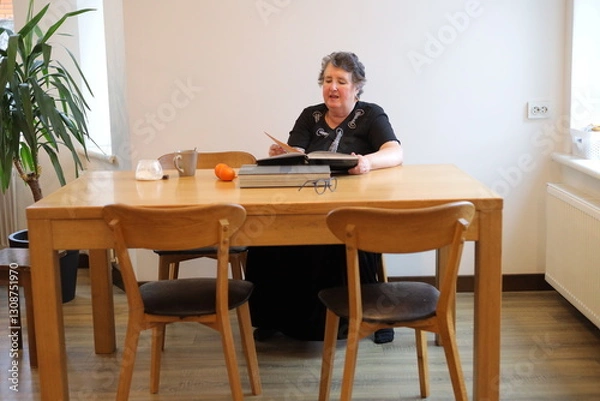 Fototapeta Grandmother and grandson talking indoors