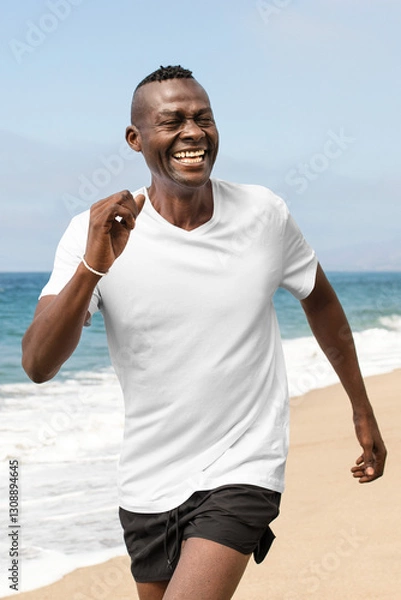 Fototapeta Png men's apparel t-shirt mockup summer fashion shoot at the beach