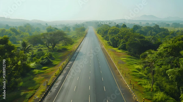 Obraz Aerial view of an empty highway in the state of Karnataka, stretching into the horizon with a smooth and well-maintained surface.