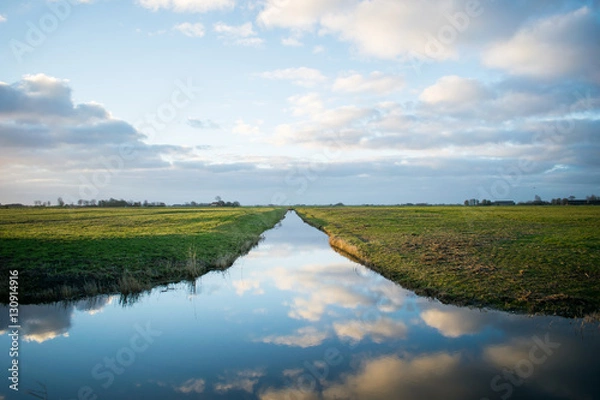 Obraz two fields divided by reflection