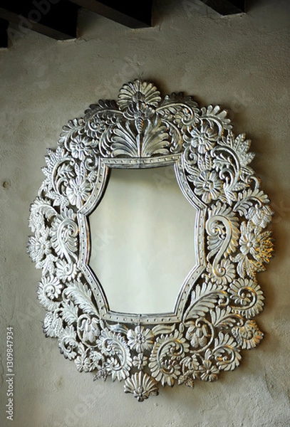 Obraz Interior decorative detail of a mansion, mirror with a large silver baroque style frame on warm gray wall background