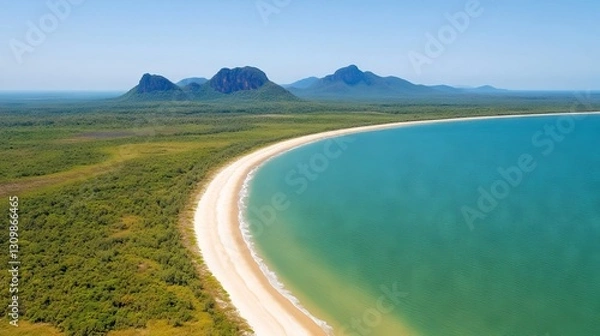 Fototapeta Aerial view of pristine beach and mountains, tranquil bay, lush green foliage