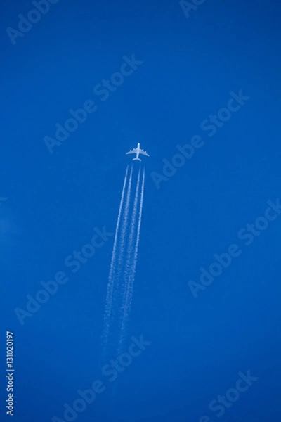 Obraz Airplane with contrails