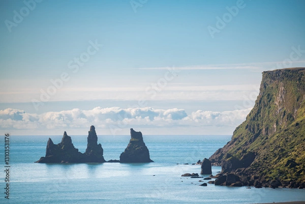 Fototapeta Reynisdrangar sea stacks emerging from the atlantic ocean in iceland
