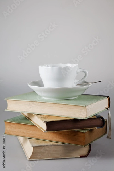 Fototapeta Kaffeetasse auf Bücherstapel