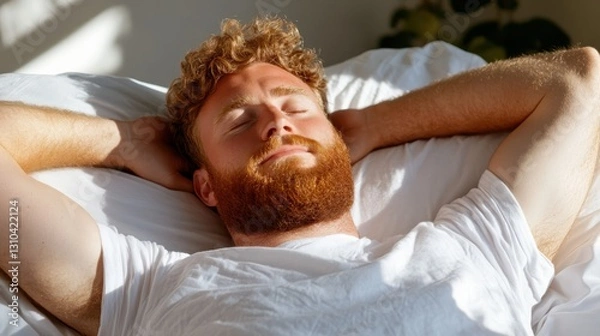 Obraz Morning serenity as a young man stretches in bed surrounded by sunlight