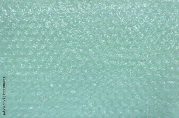 Fototapeta Green plastic bubble wrap texture background, Polyethylene bubble wrap, above view