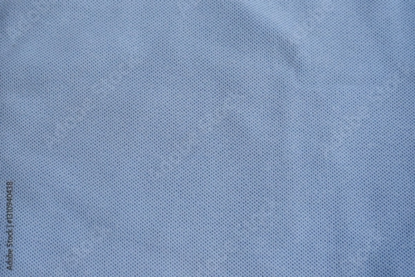 Fototapeta Texture of turquoise blue cotton pique fabric. Flat lay style, close up. Commonly use for t- shirt. Woven fabric characterized by a pattern of raised parallel cords or geometric designs. 