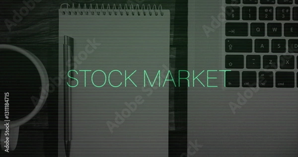 Fototapeta Image of stock market text and data processing over laptop on desk