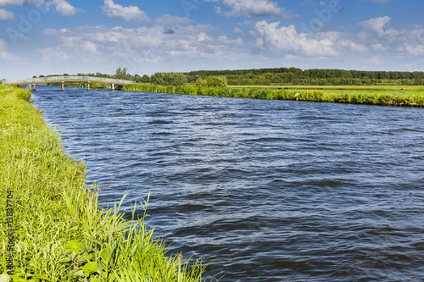 Fototapeta open water and a bridge