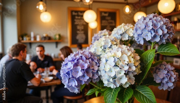 Obraz Vibrant hydrangeas in busy café, floral ambiance