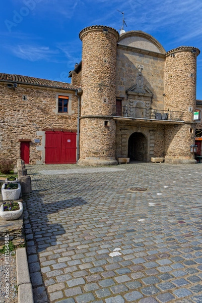 Fototapeta SAINTE-CROIX, FRANCE, March 3, 2025 : Fortified entrance towers of the Chartreuse Sainte-Croix, the only example of an old monastery transformed into a charming village.