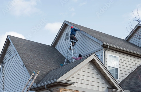 Obraz Multi-level Siding Repair After Storm in Midwest
