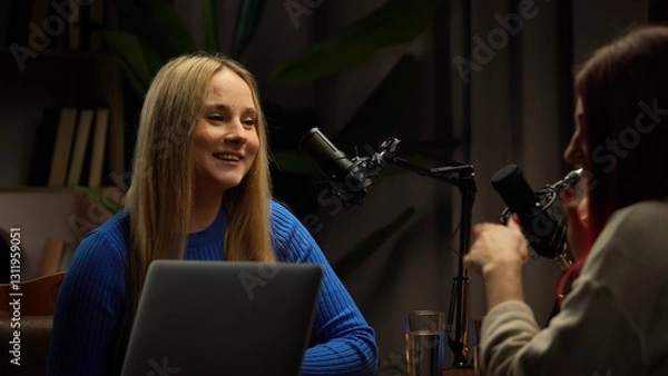 Fototapeta Two Influencers of women being interviewed in a loft-style podcast studio