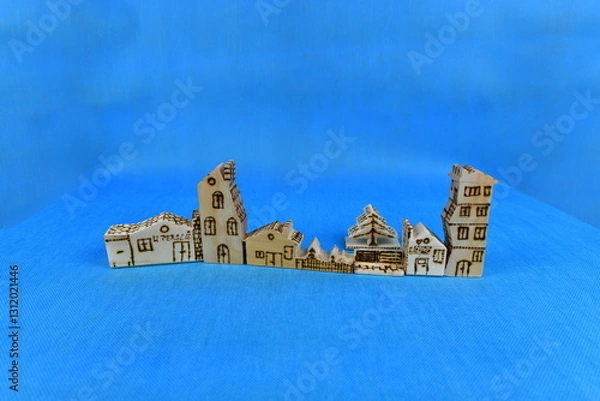 Obraz Hand carved soft spruce wood play houses and tree decorated by burning.  The houses and tree were made by me.
