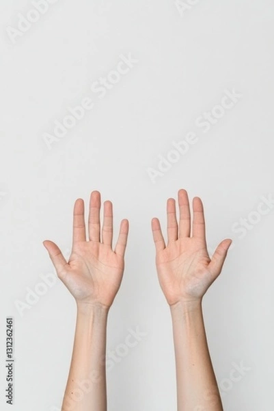 Fototapeta single pair of outstretched hands against plain white background symbolizing connection and compassion copy space above