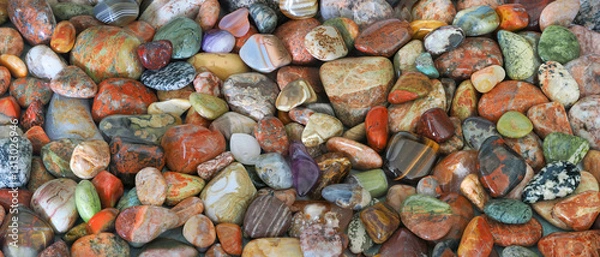 Fototapeta A Focus Stacked Close-up Panorama Image of Collection of Tumbled Rocks Found on the Shore of Lake Superior