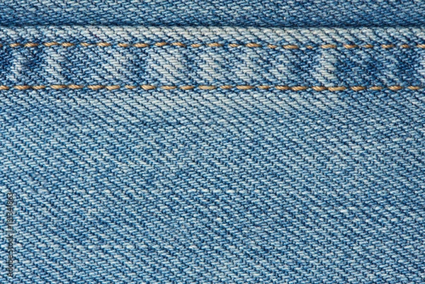 Obraz Stitches on light blue jeans background
