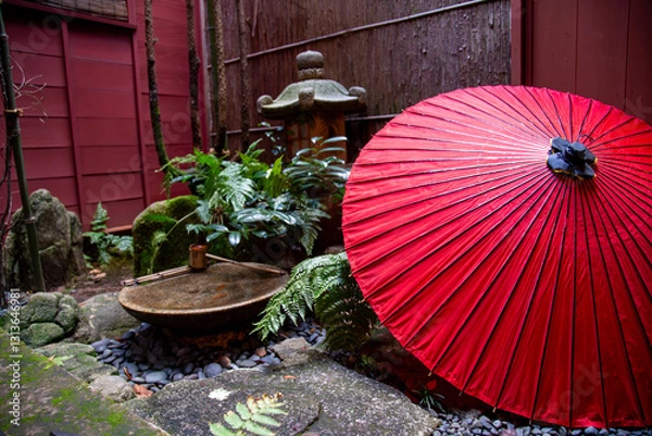 Fototapeta A Japanese umbrella within a secluded japanese garden within a home.