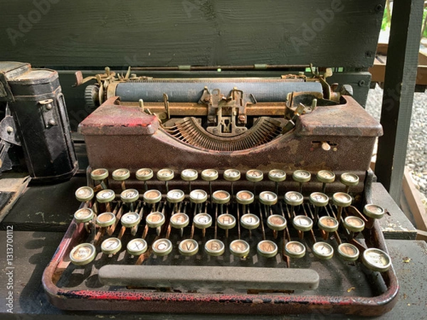Fototapeta Old rusty antique typewriter on the table