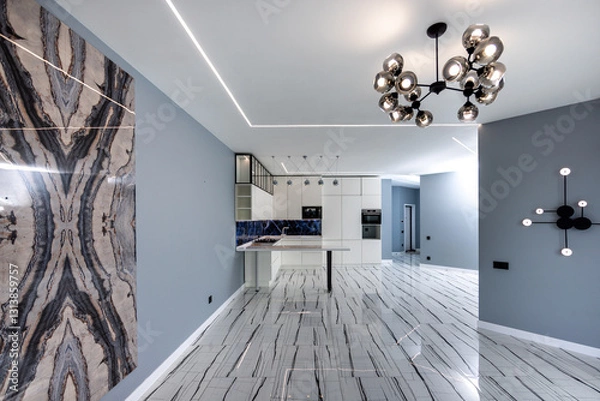 Obraz A large open living room with a white kitchen and a black chandelier hanging from the ceiling