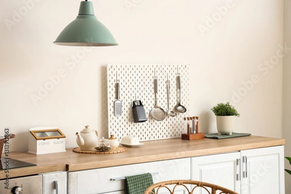 Fototapeta Interior of kitchen with white counter and peg board. Closeup