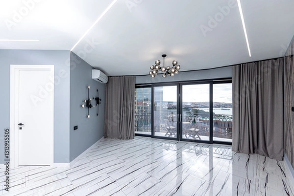 Obraz A large open living room with a white door and a window. The room is empty and has a modern feel