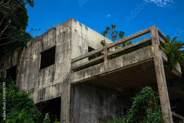 Fototapeta Beautiful abandoned building on the seashore. Sunny beach. Beautiful sea. Concrete walls.