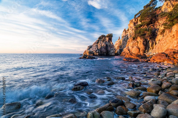 Fototapeta Beautiful sunrise on the coastline of the Mediterranean Sea (Cala S'Agulla, Costa Brava - Spain)