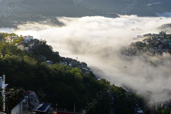 Fototapeta sea of cloud over steep hillside in Aizawl, Mizoram