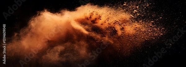 Fototapeta A warm-toned explosion of cinnamon powder frozen mid-air on an isolate background
