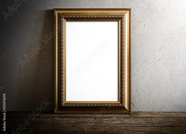 Fototapeta luxurious photo frame on wooden table over grunge background