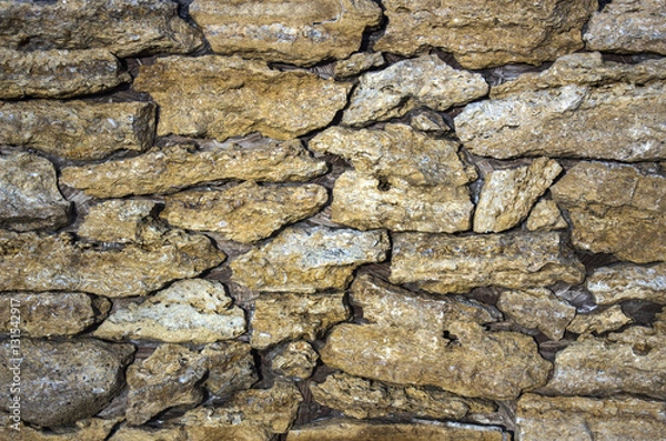 Fototapeta wall of the shell, in the form  wild cobblestone
