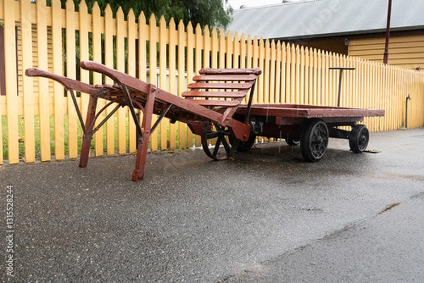 Obraz old luggage carts on a train station