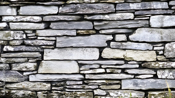 Fototapeta Gray stacked stone wall with layered rock formations creating a textured rustic background UHD 4K Image