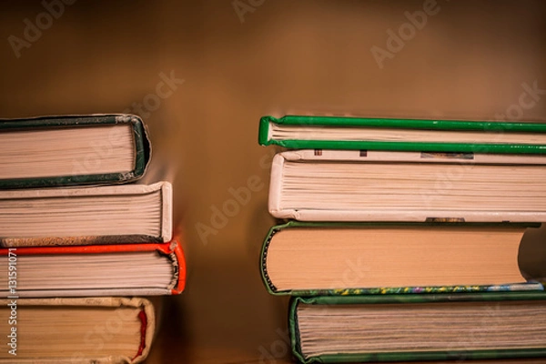Fototapeta pile of stacked books side view