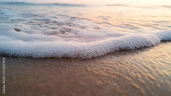 Fototapeta close up of sand with wave and copy space.