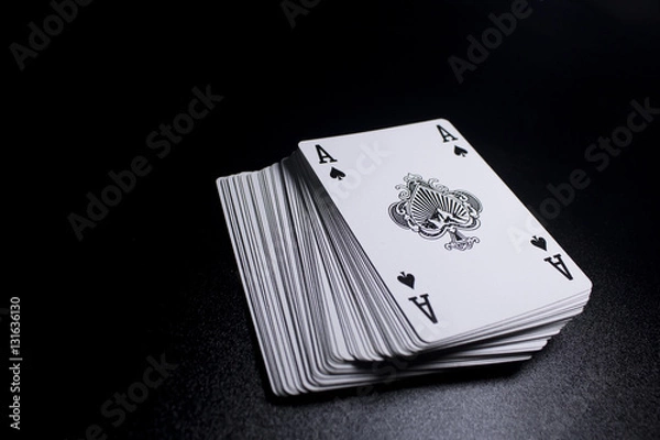 Obraz poker card stack deck on dark black background