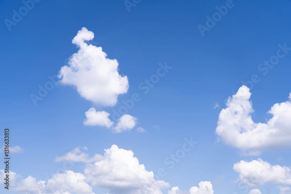 Fototapeta Sky background with white clouds on a bright day