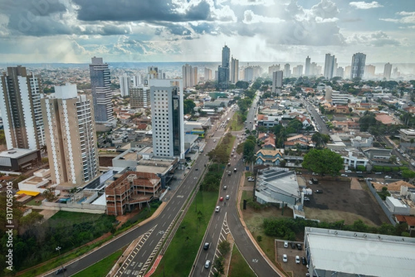 Fototapeta Aerial view of Campo Grande city at Afonso Pena Avenue region, with a light rain in the afternoon. Campo Grande MS Brazil.