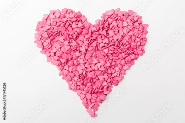 Obraz pink heart made of many smaller hearts on a white background. festive background for Valentine's day, birthday, holiday